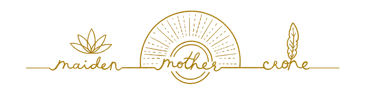 A horizontal gold line-art logo reading 'maiden mother crone' with a lotus flower, a sunburst, and a feather on a white background.